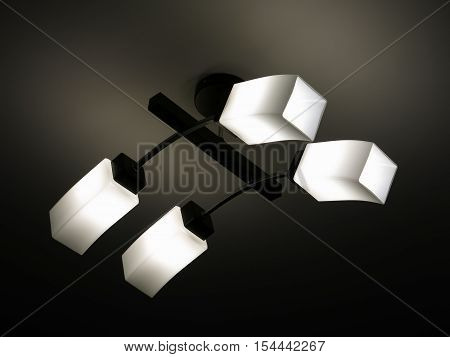 chandelier in a modern style which is hanging on the ceiling