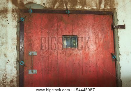Closeup of old red wooden door , dirty door