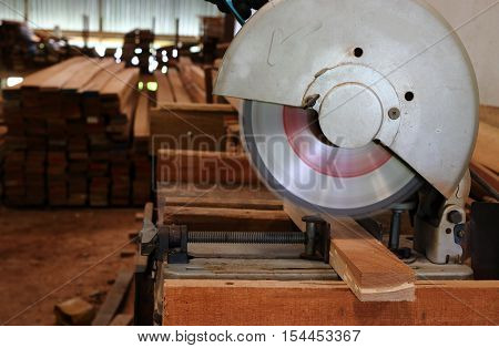 compound miter saw cutting wooden plank , Cutting wood
