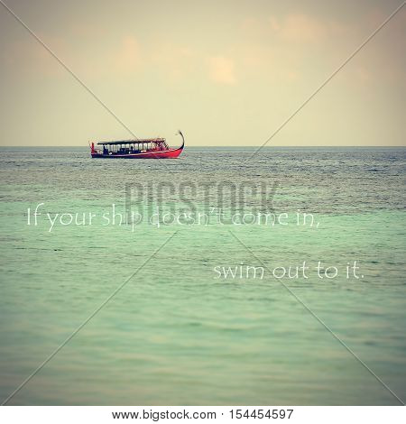 Inspirational Typographic Quote on Dhoni boat in Turquoise clear water background.