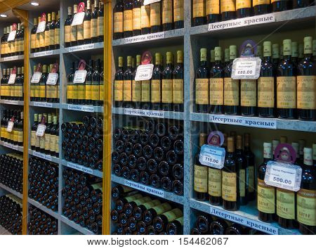 Massandra, Russia - November 09, 2015: Shelves with wine in the company shop winery Massandra Crimea