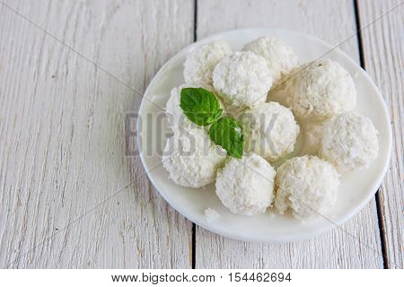 Homemade coconut candies with filling of cream and nut