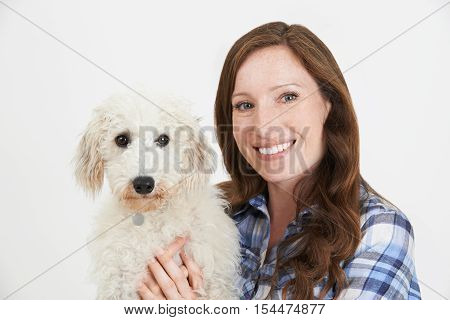 Studio Shot Of Woman With Pet Lurcher Dog