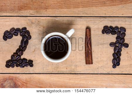 a word of coffee 2017 on wood background