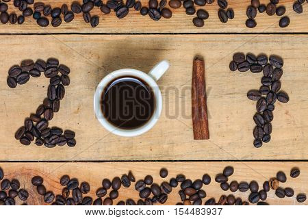 a word of coffee 2017 on wood background