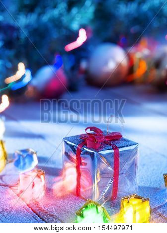close up view  of gifts boxes  on snowbound  wooden back
