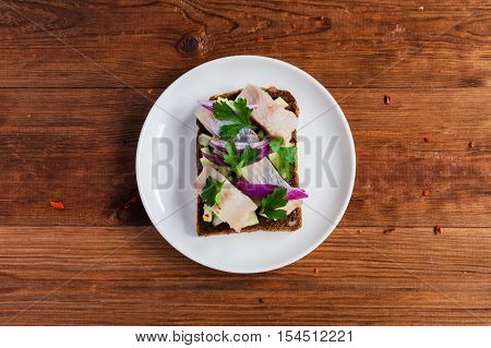 Smorrebrod - danish open sandwich with fish herring cheese
