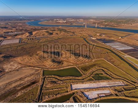 Aerial view of the bridge over the river Guadiana. Salty lake bottom.