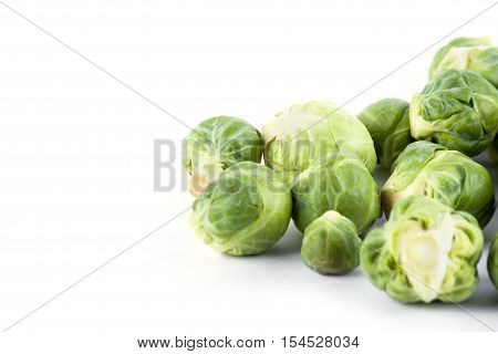 Fresh ripe brussels sprouts isolated on white background