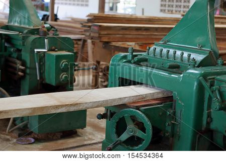 Planing of wood machine in workshop , carpenter , woodshop