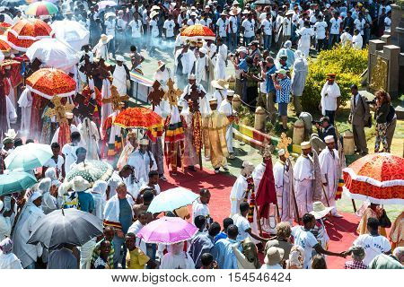 Gondar Ethiopia - January 19 2016: A crowd of faithful and tourists surrounding a procession in the annual religious celebration of Timket (epiphany)