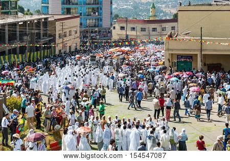 Gondar Ethiopia - January 19 2016: A crowd of faithful and tourists surrounding a procession in the annual religious celebration of Timket (epiphany)