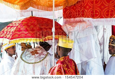 Gondar Ethiopia - January 19 2016: Orthodox priests attends the procession in the annual religious celebration of Timket (epiphany)