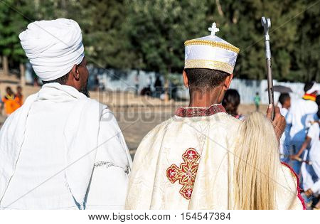 Gondar Ethiopia - January 19 2016: Orthodox priests attends the procession in the annual religious celebration of Timket (epiphany)