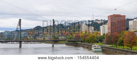 Portland Oregon city downtown waterfront park by Hawthorne Bridge in fall season panorama