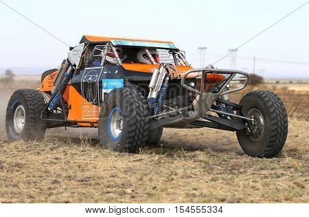 Forty Five Degree Close-up View Of Speeding Orange Zarco Rally Car