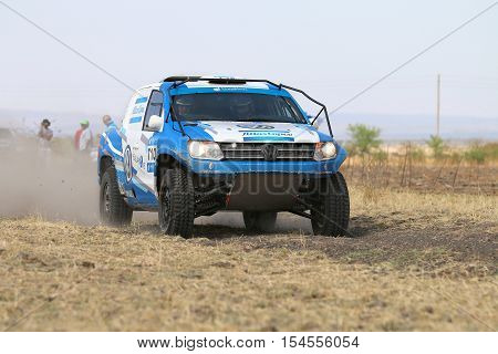 Close-up View Of Speeding Blue And White Vw Amarok Twin Cab Rally Car