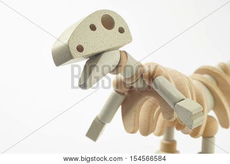 Dinosaur wooden articulated toy isolated on white. Horizontal