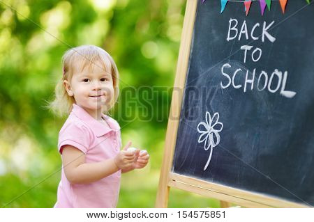 Adorable little girl feeling excited about going to preschool for the first time