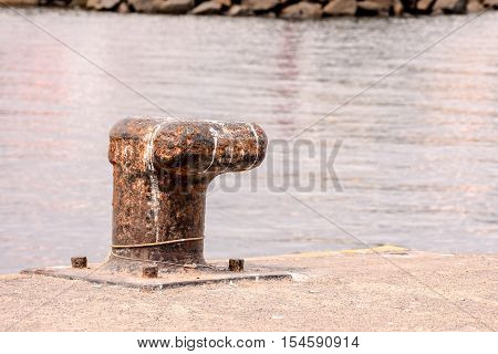 Rusty Metal Mooring Bolard For Big Ship