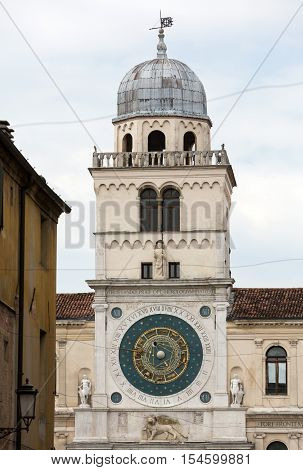 PADUA, ITALY - MAY3, 2016: Clock tower building of medieval origins overlooking Piazza dei Signori in Padova Italy