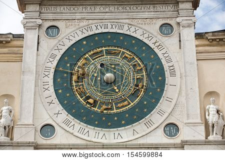 PADUA, ITALY - MAY3, 2016: Clock tower building of medieval origins overlooking Piazza dei Signori in Padova Italy