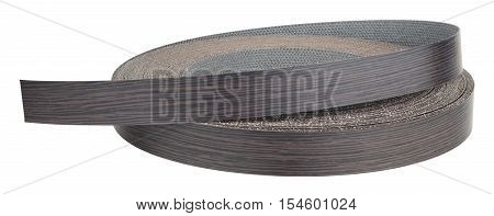Plastic pre glued edge banding tape for furniture decor and repair. Object is isolated on  white background without shadows.