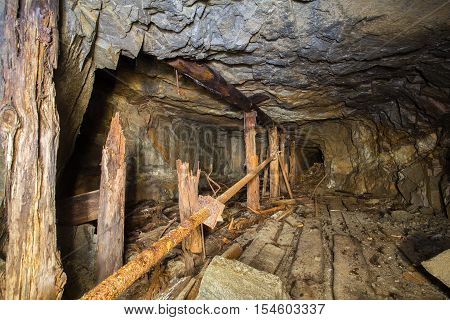 Old abandoned gold ore mine tunnel in Ural