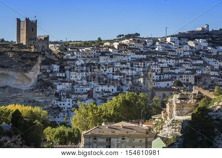 Alcala del Jucar Spain - October 29 2016: Panoramic view of the city on top of limestone mountain is situated Castle of the 12TH century Almohad origin take in Alcala of the Jucar Albacete province Spain