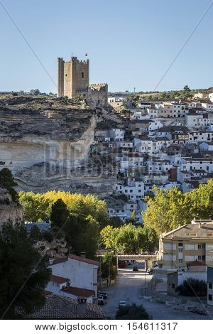 Alcala del Jucar Spain - October 29 2016: Panoramic view of the city on top of limestone mountain is situated Castle of the 12TH century Almohad origin take in Alcala of the Jucar Albacete province Spain