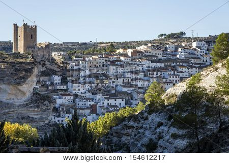 Alcala del Jucar Spain - October 29 2016: Panoramic view of the city on top of limestone mountain is situated Castle of the 12TH century Almohad origin take in Alcala of the Jucar Albacete province Spain