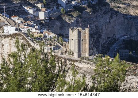 Alcala del Jucar Spain - October 29 2016: Panoramic view of the city on top of limestone mountain is situated Castle of the 12TH century Almohad origin take in Alcala of the Jucar Albacete province Spain
