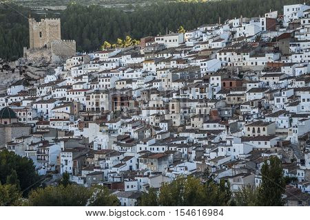 Alcala del Jucar Spain - October 29 2016: Panoramic view of the city on top of limestone mountain is situated Castle of the 12TH century Almohad origin take in Alcala of the Jucar Albacete province Spain