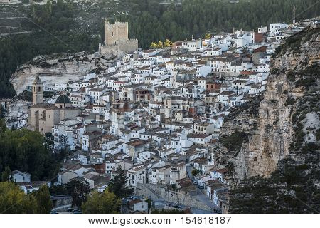 Alcala del Jucar Spain - October 29 2016: Panoramic view of the city on top of limestone mountain is situated Castle of the 12TH century Almohad origin take in Alcala of the Jucar Albacete province Spain