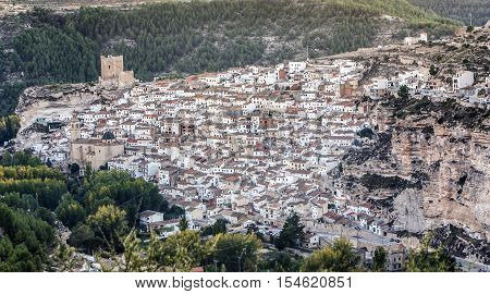 Alcala del Jucar Spain - October 29 2016: Panoramic view of the city on top of limestone mountain is situated Castle of the 12TH century Almohad origin take in Alcala of the Jucar Albacete province Spain