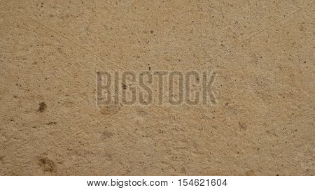 Real stone wall texture background. Light colour pattern. Grainy light stone detail textured background. Best way show your design or illustration with this actual stone photo texture.