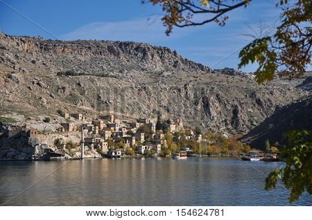 Gaziantep, Turkey - December 08, 2014: Minaret of the mosque in the water in village near Halfeti