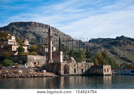 Gaziantep, Turkey - December 08, 2014: Minaret of the mosque in the water in village near Halfeti