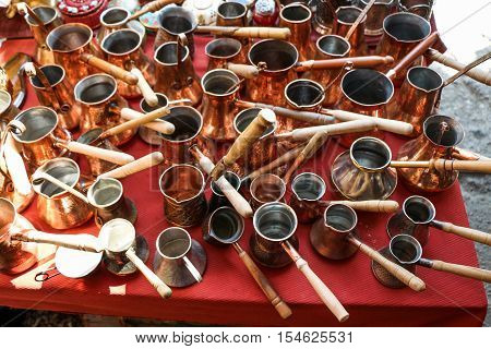 Selling old metal cookware in a market place