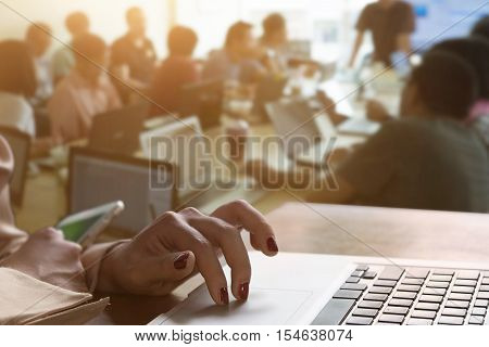 Closeup Hands of secretary business people working at meetingvintage effectBusiness talk to plan conceptsecretary woman is memory plan to laptopvintage tone