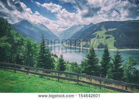 Amazing summer morning on the fantastic Speicher Durlassboden lake. Alps, Austria, Europe. Toned like Instagram filter