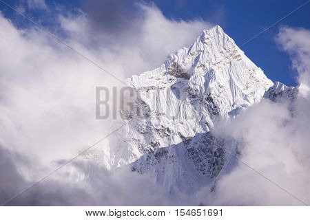 Kangtega mountain with clouds. During the way to Pheriche Village (4240 m). Route of Lukla-Everest base camp. East Nepal, Himalayas