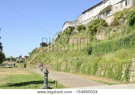 TUI, SPAIN - AUGUST 7, 2016: People walking in a pathway in Tui a town of the province of Pontevedra in Galicia Spain.