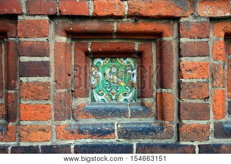building wall decoration in the form of decorative glazed ceramic picture ceramic ornament closeup