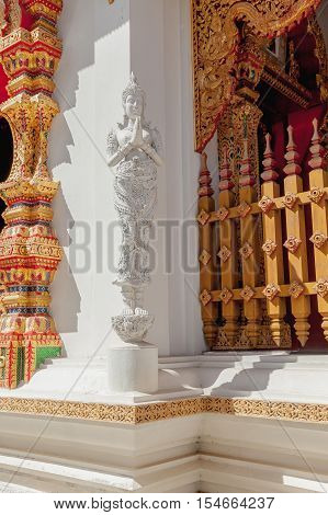 Thailand Angel sculpture on wall at thai temple