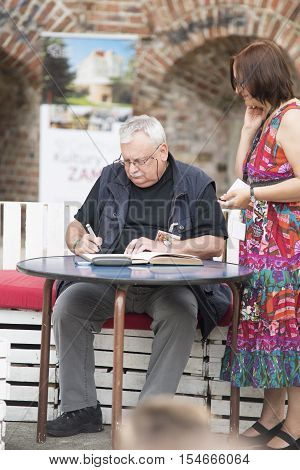 Wroclaw, Poland, June 28, 2014 Andrzej Sapkowski Sign A Witcher Book For The Fan, Authot Of 