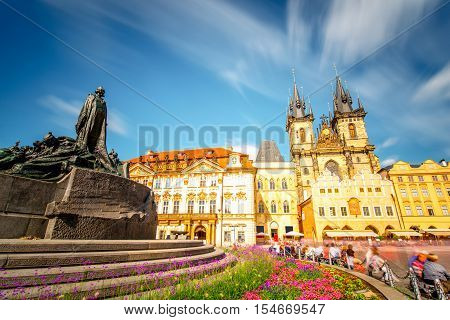 View on the famous cathedral and monument on the old town square in Prague city. Long exposure image technic with blurred people and clouds
