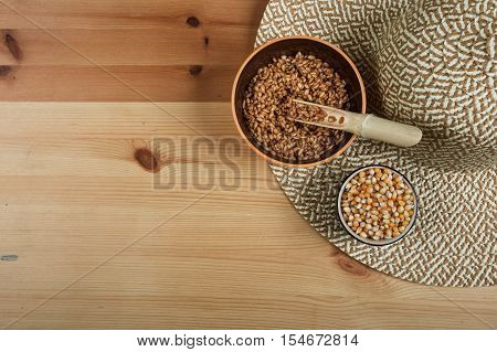 Excellent different cereals on a wooden background.