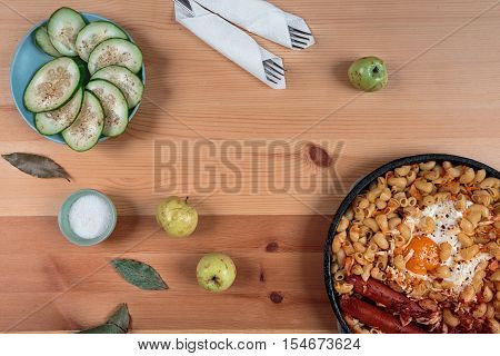 Pasta with egg and green cucumber salad