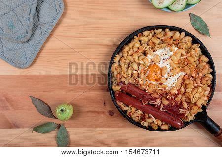 Pasta with egg and green cucumber salad